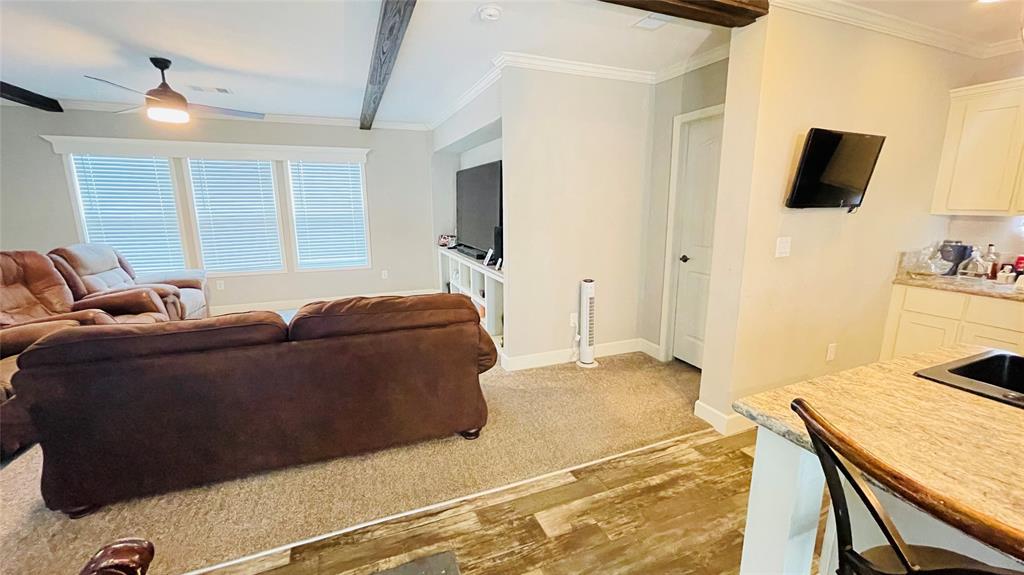 8394 Lake Road Mansfield, TX 76063 - Photo 7 of 22 a living room with a bed furniture and a flat screen tv