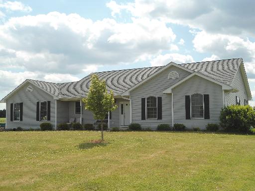 23319 Lucas Road DeKalb, IL 60115 - Photo 1 of 14 a front view of a house with a yard