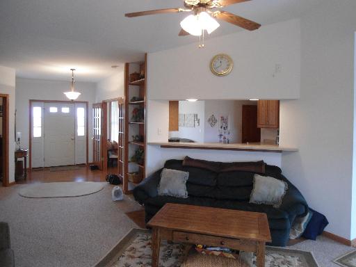 23319 Lucas Road DeKalb, IL 60115 - Photo 3 of 14 a living room with furniture and a wooden floor