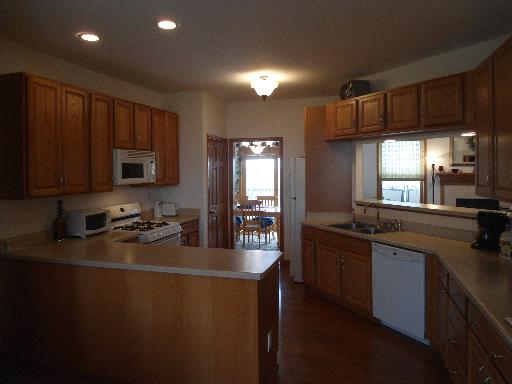 23319 Lucas Road DeKalb, IL 60115 - Photo 4 of 14 a kitchen with sink a stove and cabinets