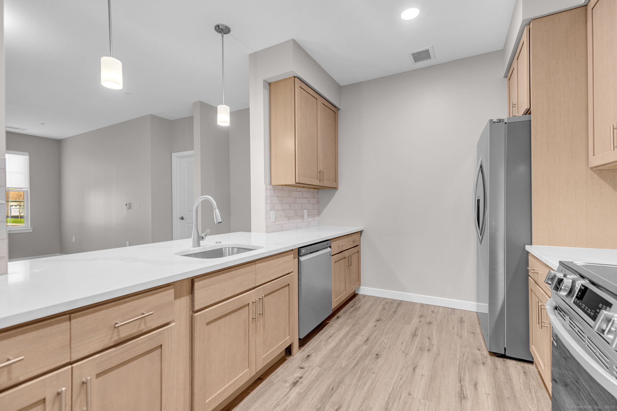 104 Episcopal Road, Unit 3 Berlin, CT 06037 - Photo 13 of 20 a bathroom with a sink a mirror and a shower