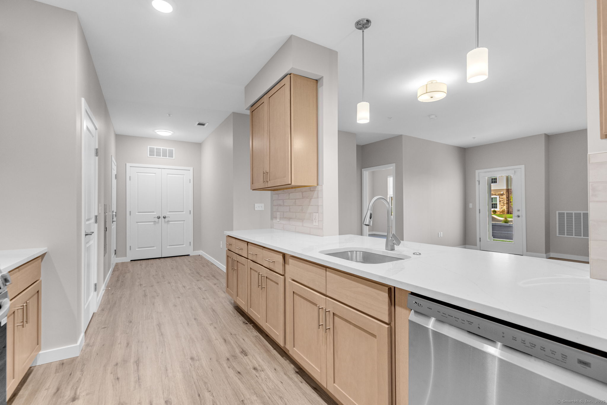 104 Episcopal Road, Unit 3 Berlin, CT 06037 - Photo 14 of 20 a kitchen with a sink cabinets and wooden floor