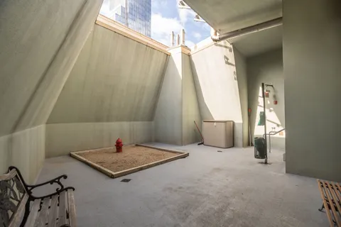 a view of a livingroom with furniture and windows