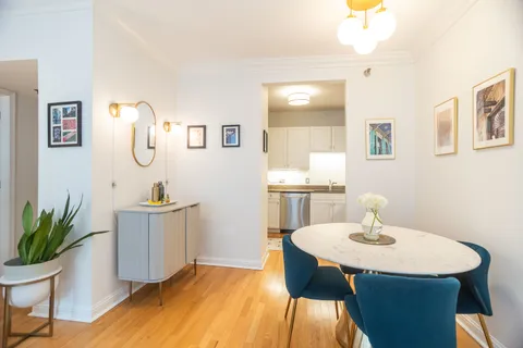 a dining room with a table and chairs