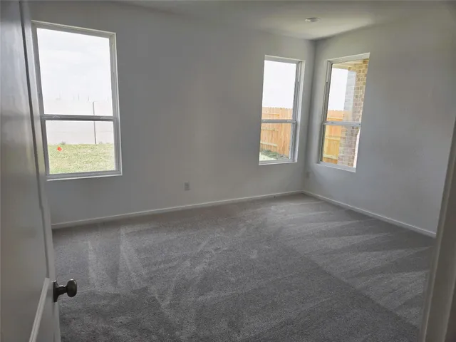 an empty room with windows