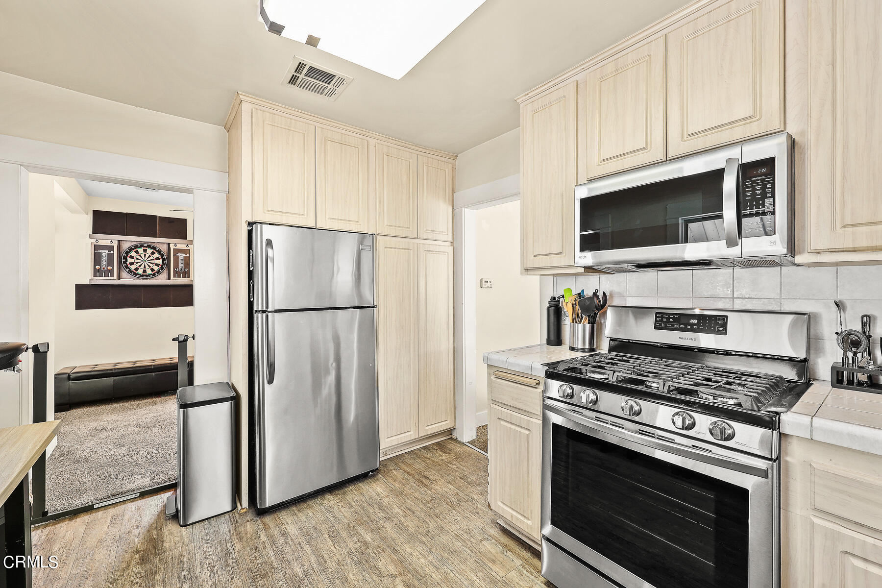 1159 Western Avenue Glendale, CA 91201 - Photo 12 of 52 a kitchen with granite countertop a refrigerator stove and microwave