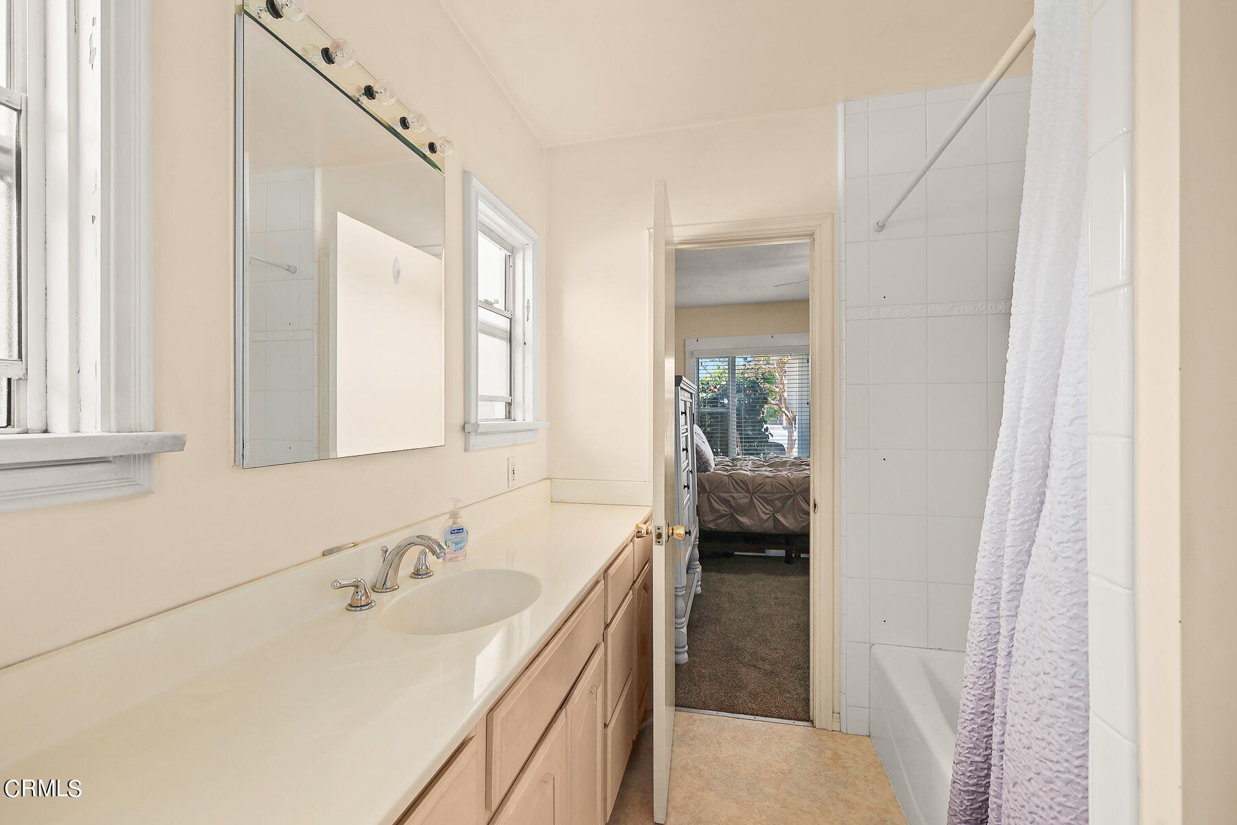1159 Western Avenue Glendale, CA 91201 - Photo 18 of 52 a en suite bathroom with a sink and a mirror