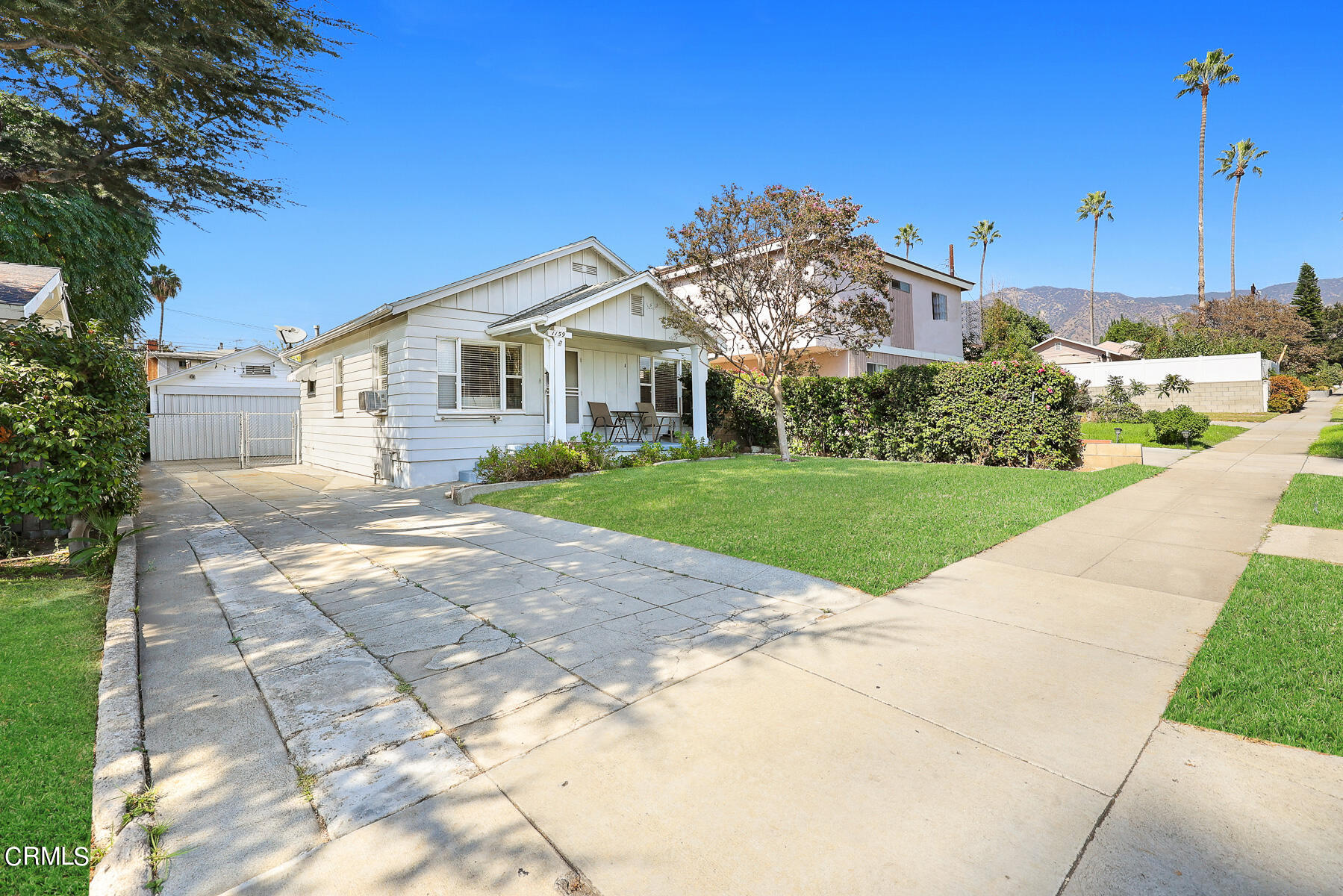 1159 Western Avenue Glendale, CA 91201 - Photo 2 of 52 a view of a house with a yard and potted plants