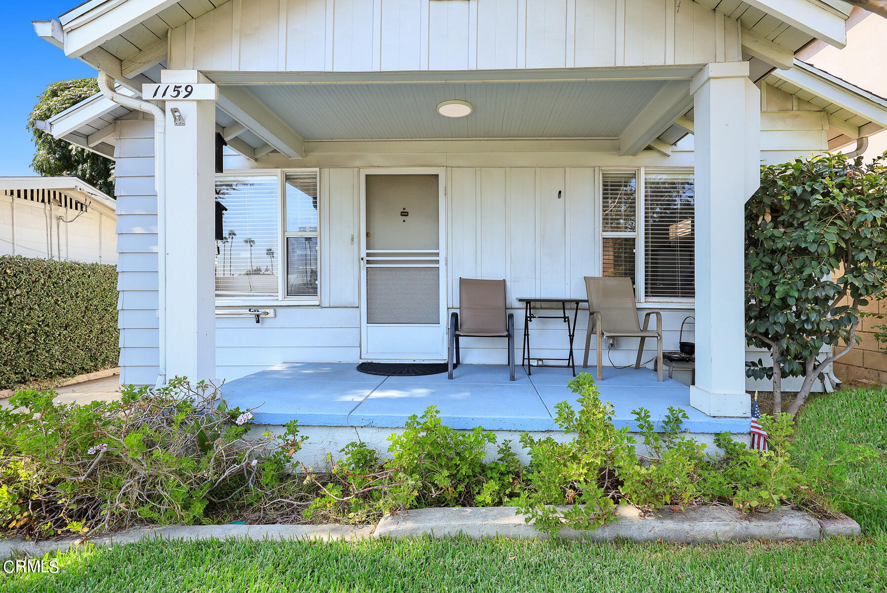 1159 Western Avenue Glendale, CA 91201 - Photo 6 of 52 a view of a patio with table and chairs potted plants and large tree
