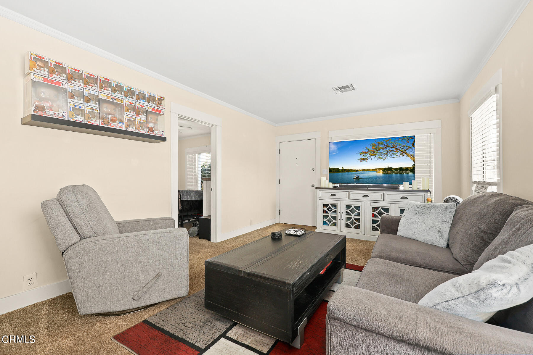 1159 Western Avenue Glendale, CA 91201 - Photo 8 of 52 a living room with furniture a rug and a flat screen tv