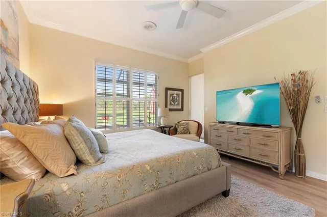 an aerial view of residential houses with yard and mountain view in back