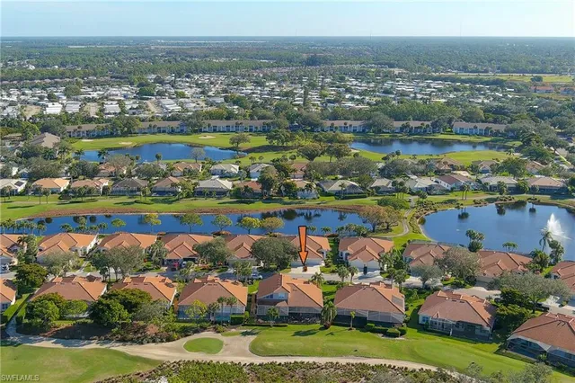 a room with lots of chairs and chandelier