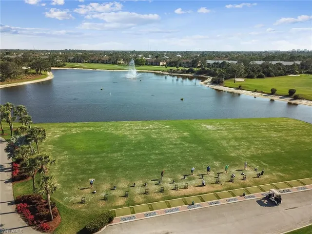 a living room filled with furniture and a book shelf