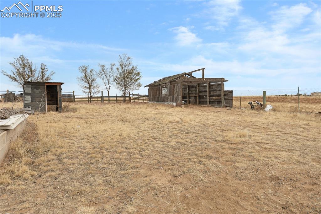 41305 Gieck Road Rush, CO 80833 - Photo 5 of 8 View of yard with a rural view and an outbuilding