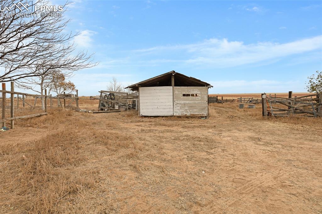 41305 Gieck Road Rush, CO 80833 - Photo 6 of 8 View of yard featuring a rural view and a storage unit