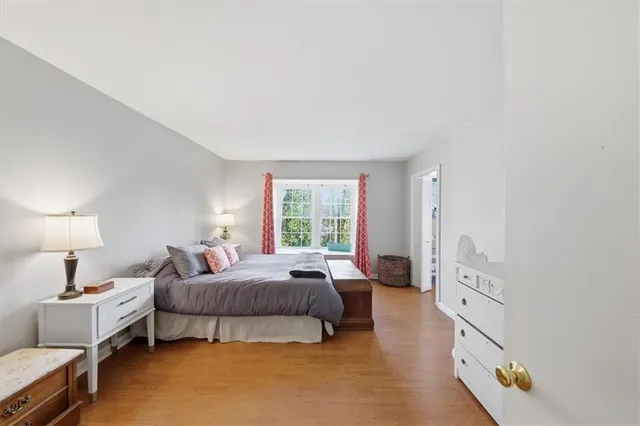 a bedroom with furniture and a window