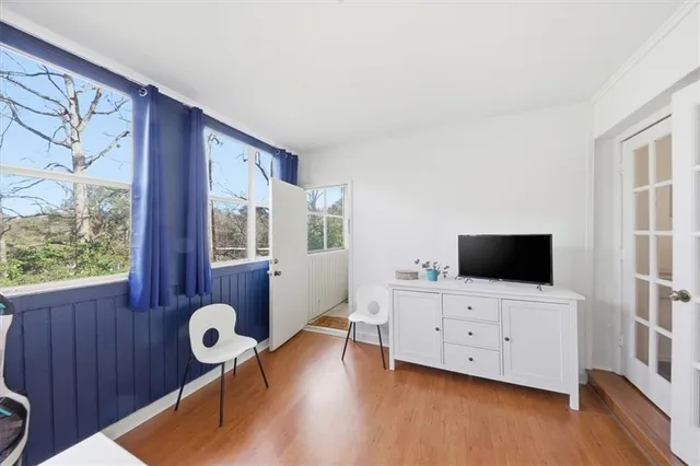 a room with furniture and wooden floor