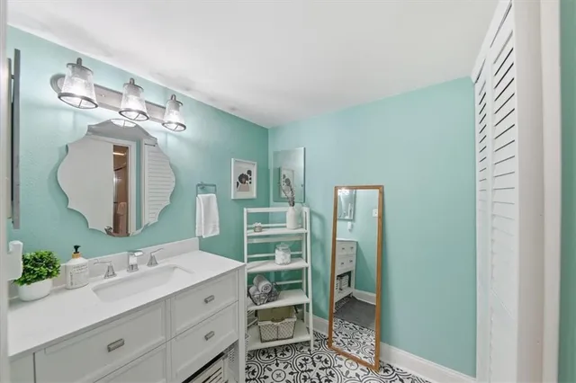 a bathroom with a double vanity sink and a mirror