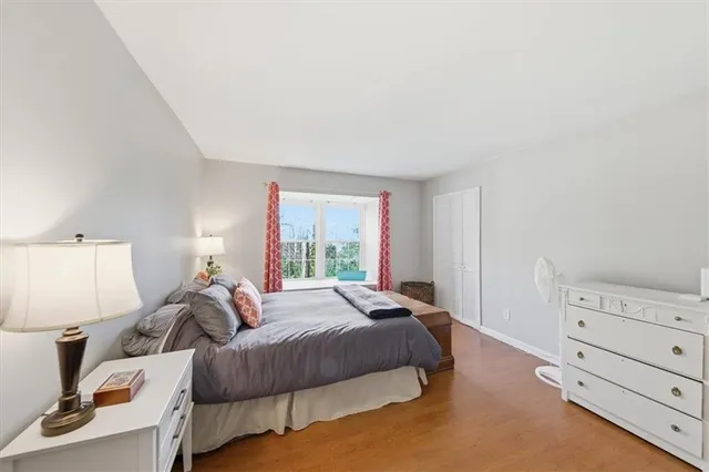 a bedroom with a bed and a night stand