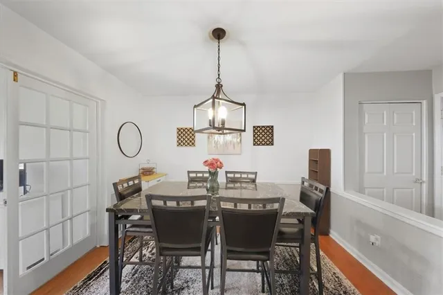 a view of a dining room furniture and chandelier