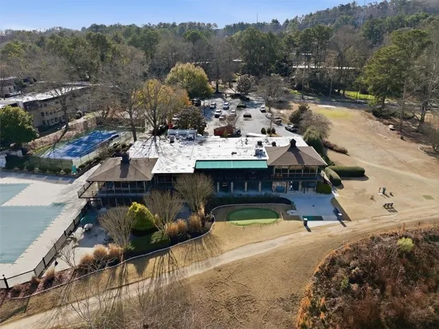 a view of a swimming pool with a patio