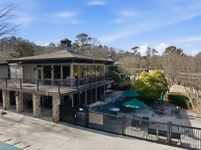 a view of a house with a balcony and a mountain view