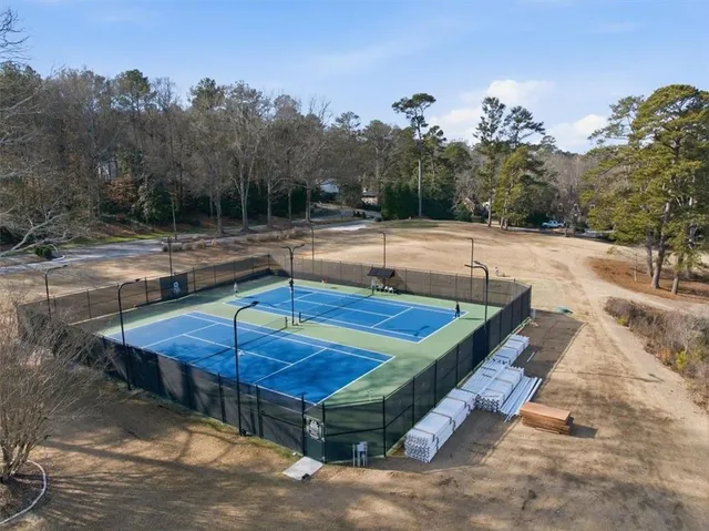 a view of a pool with a yard