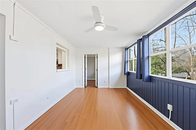 a view of a room with a large window
