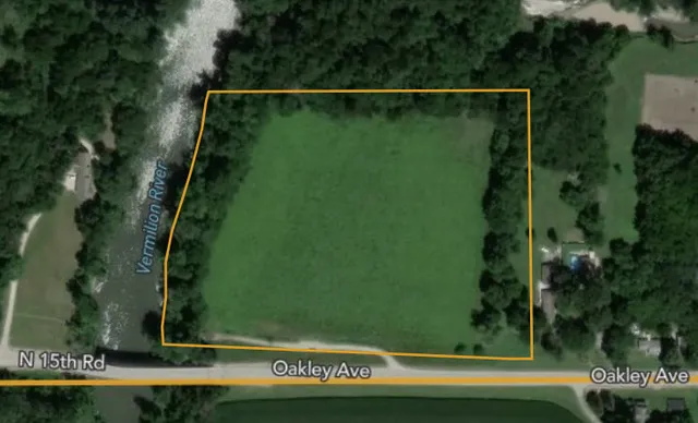 an aerial view of a residential houses with outdoor space and street view