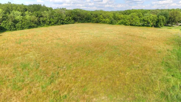 a view of a field with an outdoor space