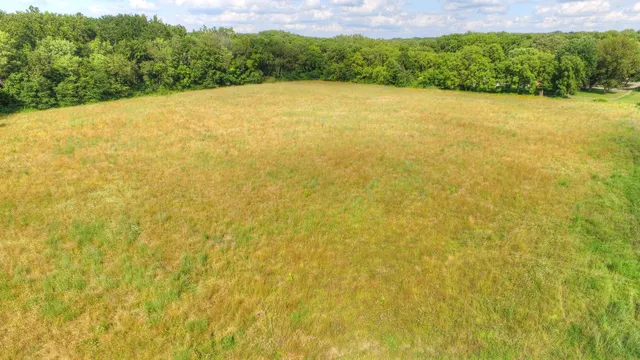 a view of a field with an outdoor space