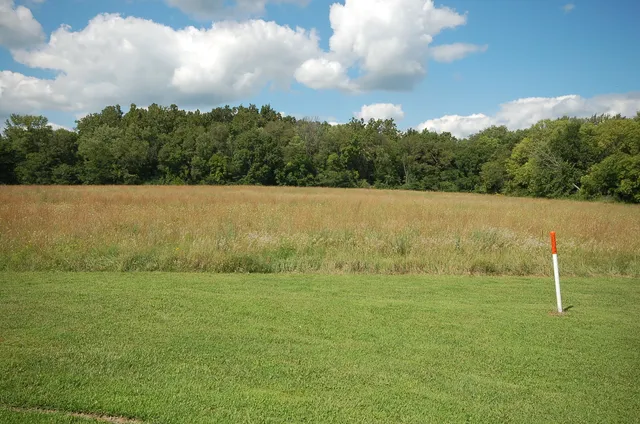 a view of a field with an outdoor space