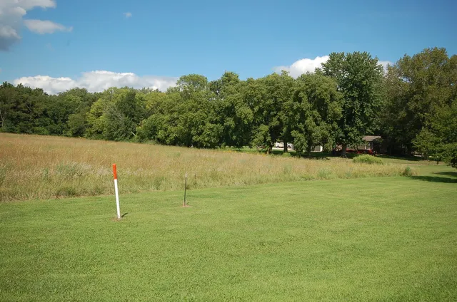 a backyard of a house with lots of green space