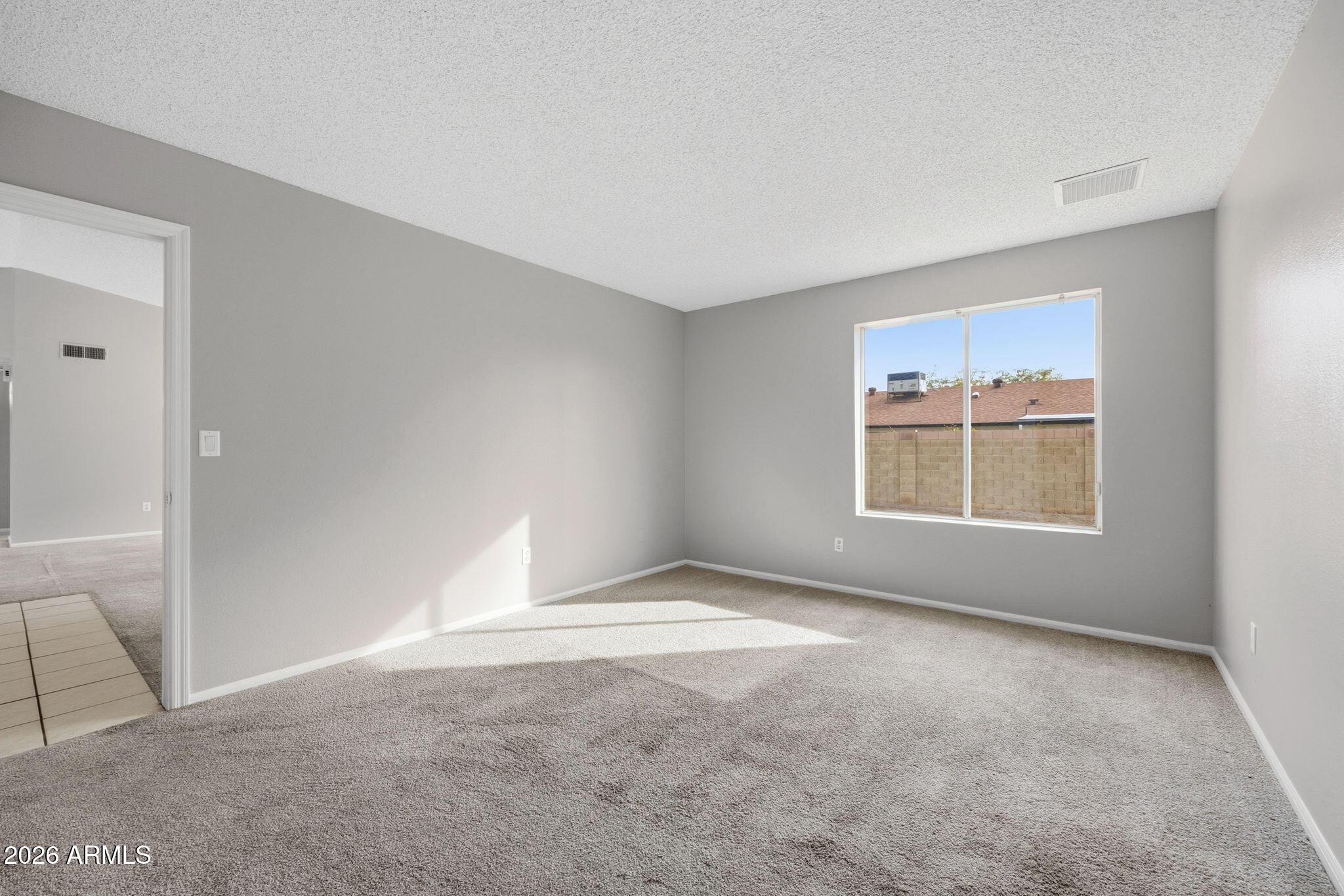 5917 East Hearn Road Scottsdale, AZ 85254 - Photo 16 of 28 a view of an empty room with a window