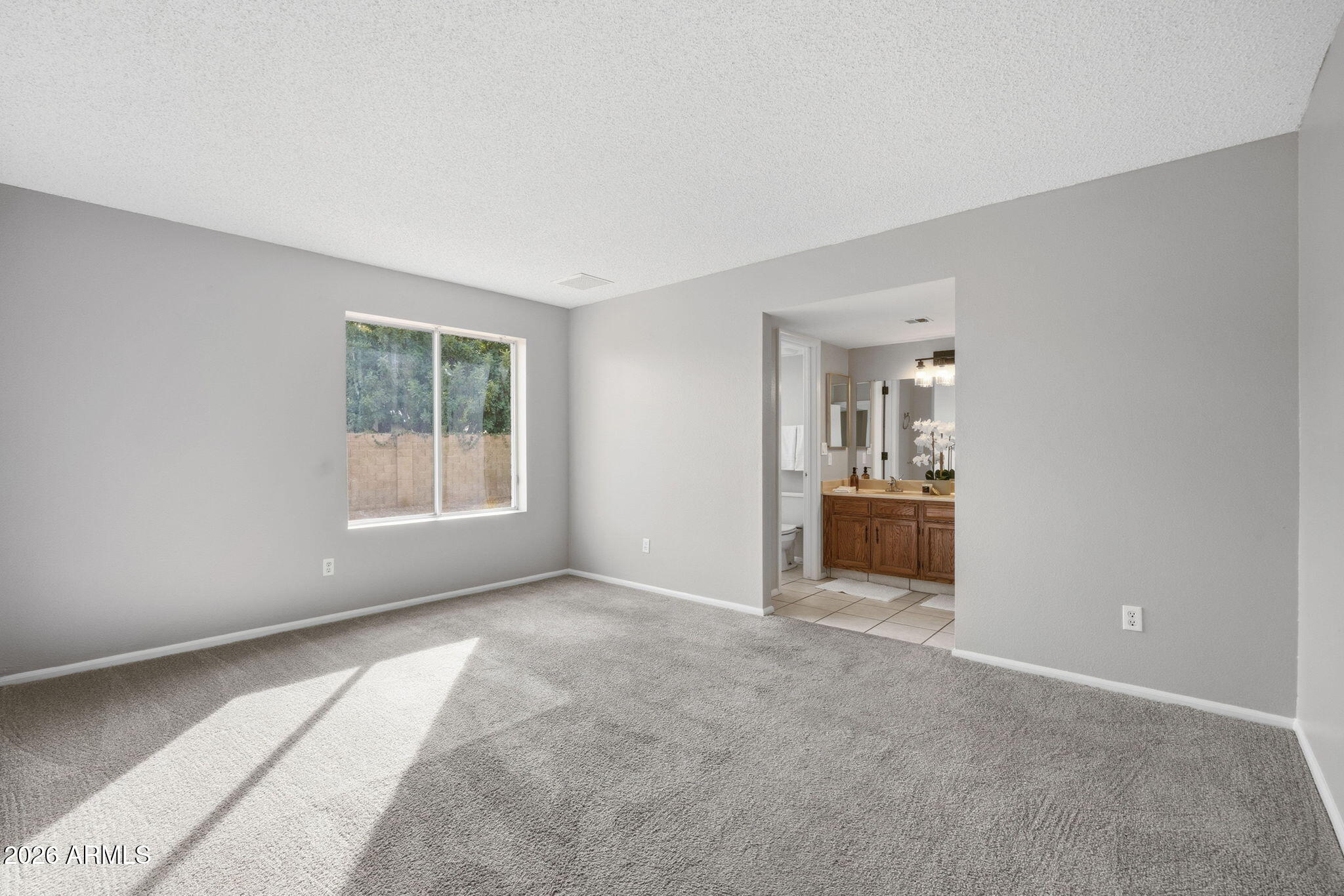 5917 East Hearn Road Scottsdale, AZ 85254 - Photo 17 of 28 a view of a big room with windows and chandelier