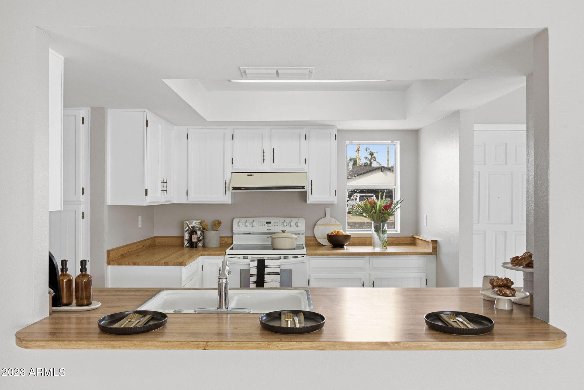 5917 East Hearn Road Scottsdale, AZ 85254 - Photo 2 of 28 a kitchen with a sink and cabinets