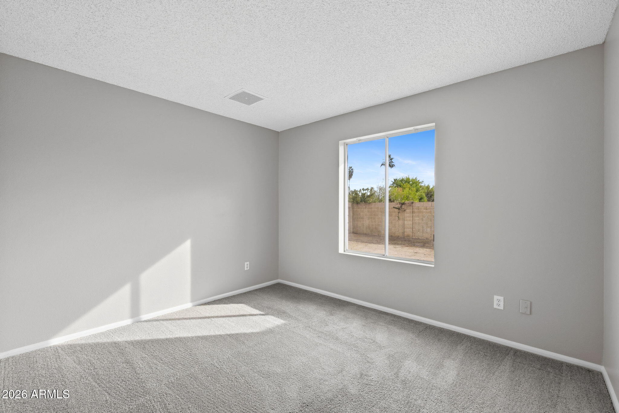 5917 East Hearn Road Scottsdale, AZ 85254 - Photo 21 of 28 an empty room with a window