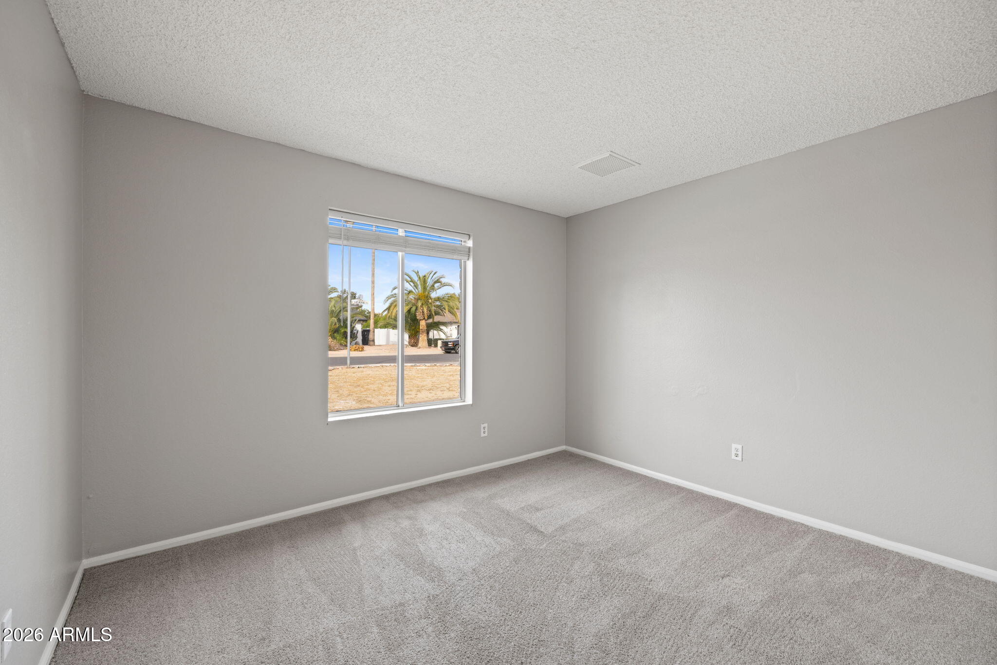 5917 East Hearn Road Scottsdale, AZ 85254 - Photo 22 of 28 an empty room with windows