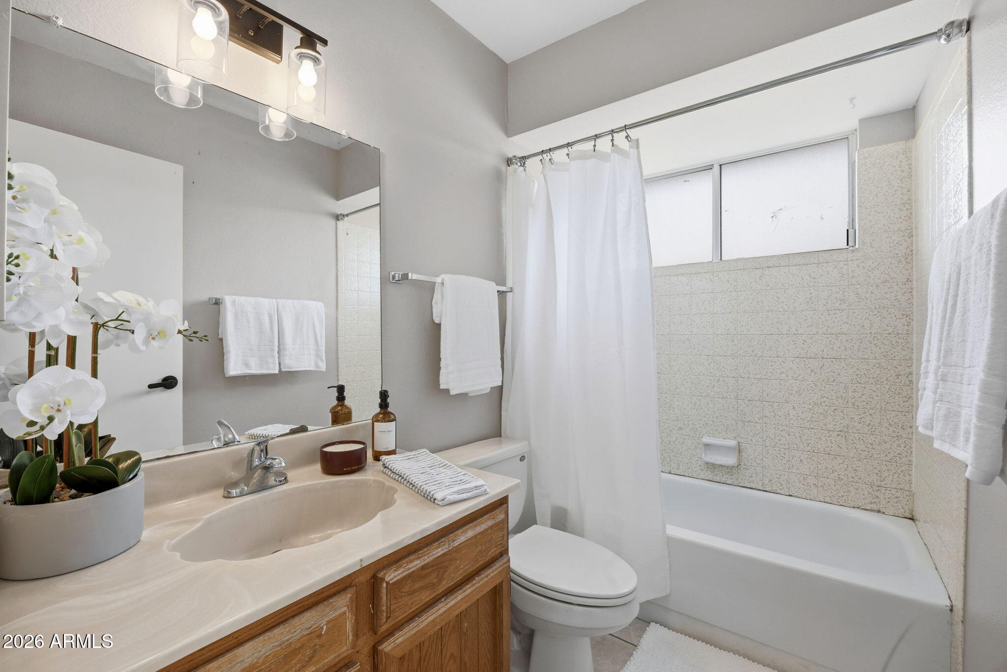 5917 East Hearn Road Scottsdale, AZ 85254 - Photo 23 of 28 a bathroom with a granite countertop sink toilet and shower