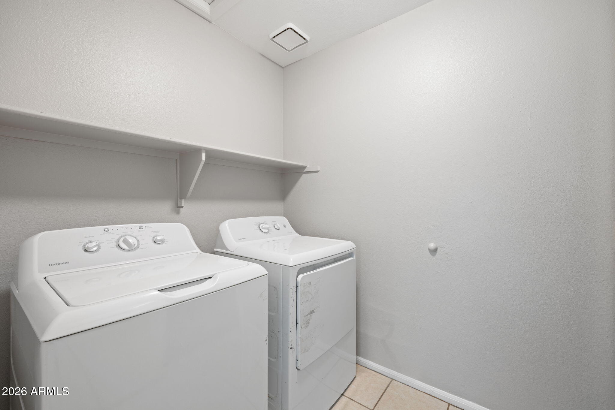 5917 East Hearn Road Scottsdale, AZ 85254 - Photo 24 of 28 a utility room with dryer and washer
