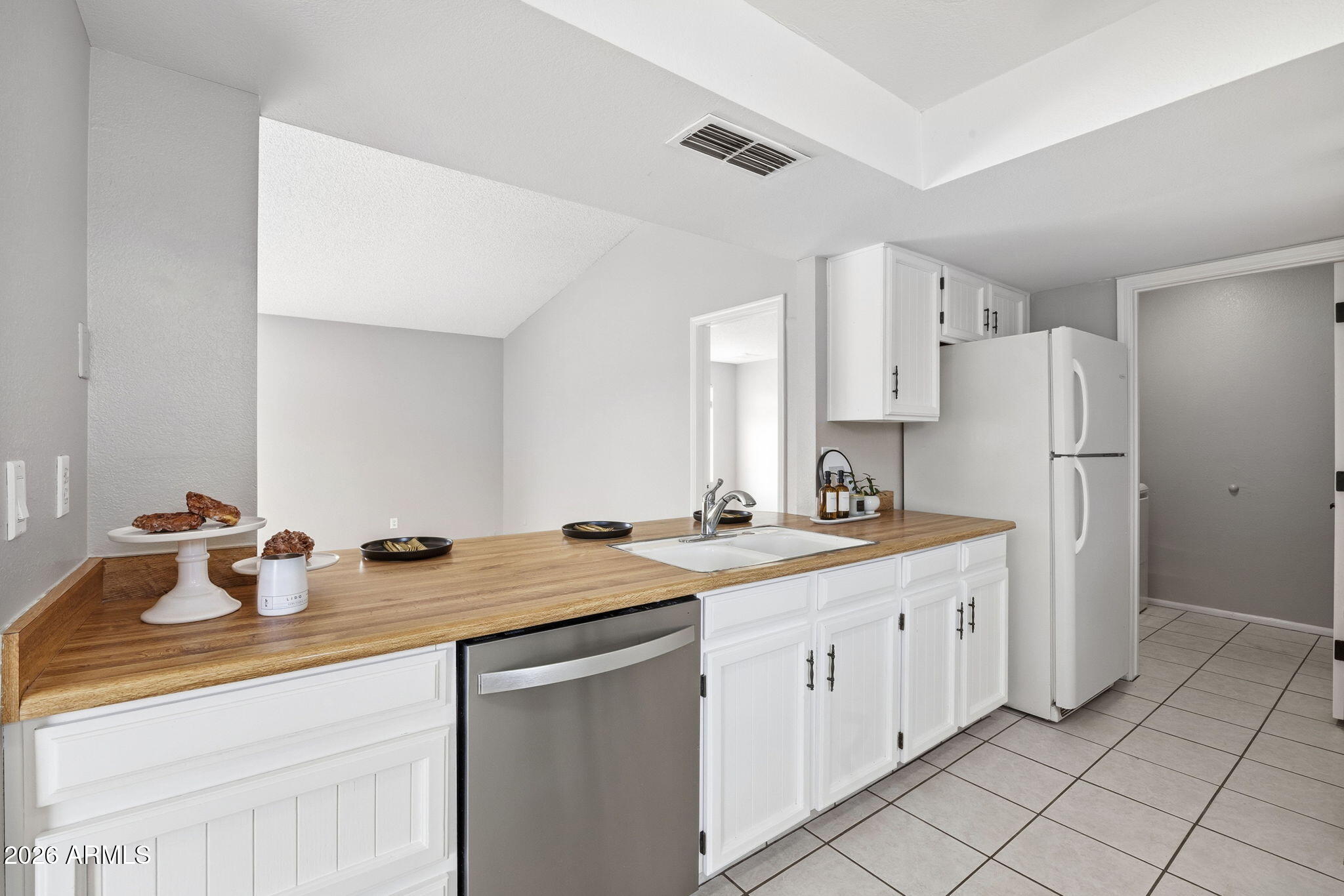 5917 East Hearn Road Scottsdale, AZ 85254 - Photo 7 of 28 a kitchen with appliances cabinets and a sink