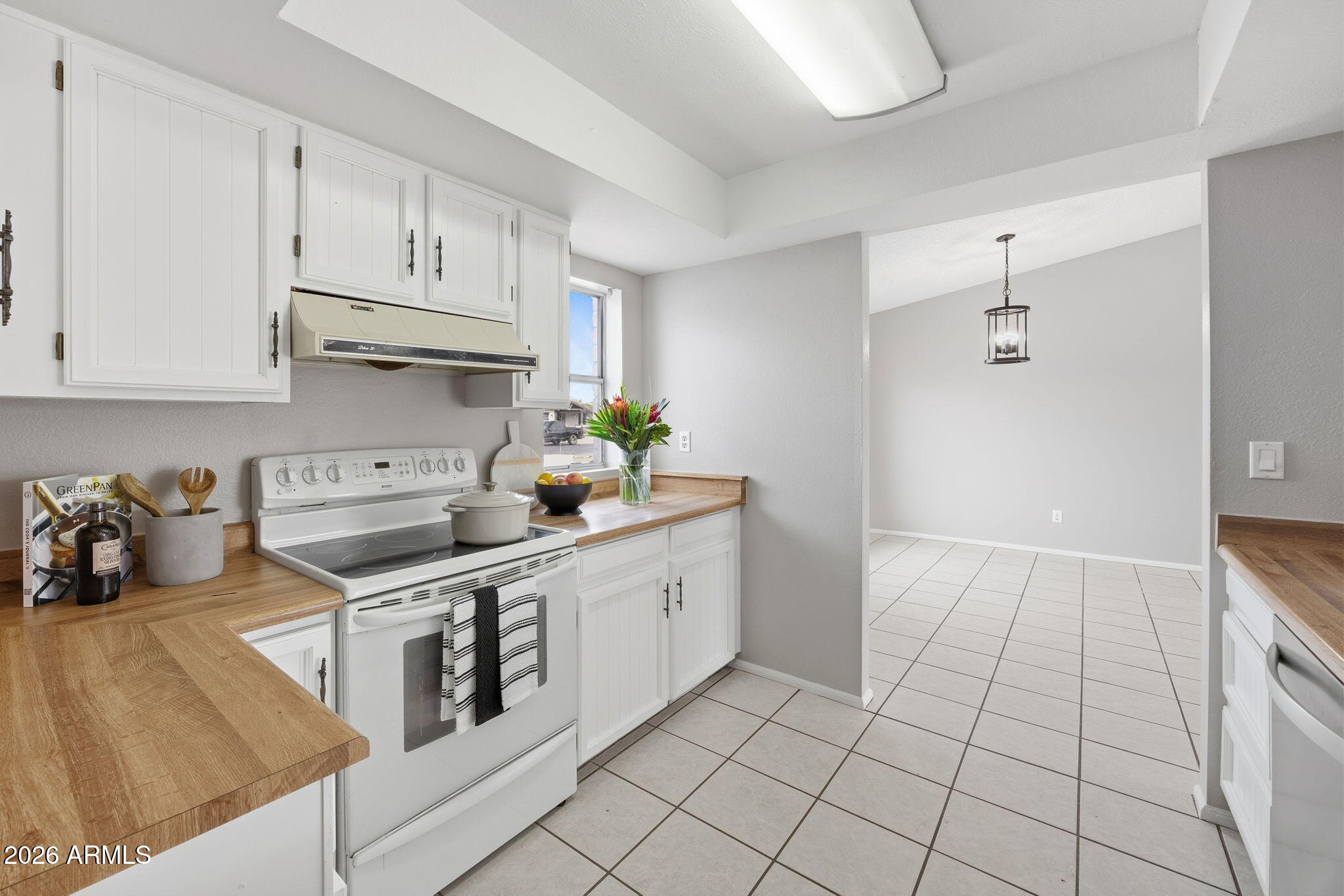 5917 East Hearn Road Scottsdale, AZ 85254 - Photo 9 of 28 a kitchen with stainless steel appliances a stove a sink and cabinets