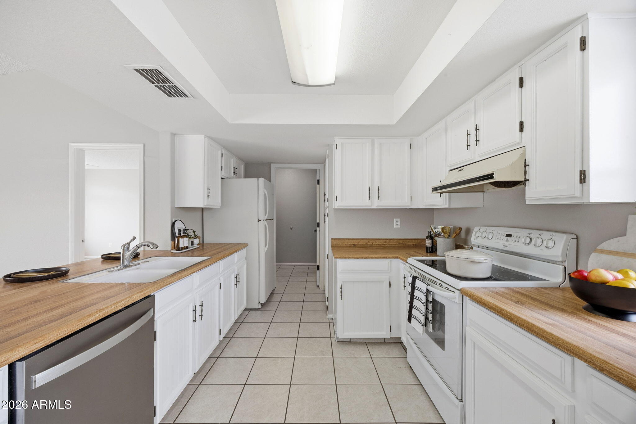 5917 East Hearn Road Scottsdale, AZ 85254 - Photo 10 of 28 a kitchen that has a sink and a stove