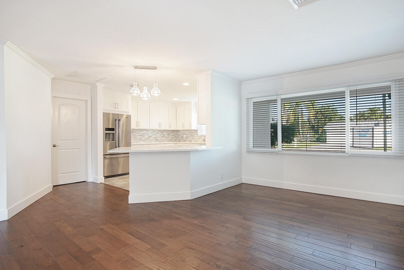 924 Pompano Drive Jupiter, FL 33458 - Photo 12 of 36 a view of kitchen with wooden floor and electronic appliances