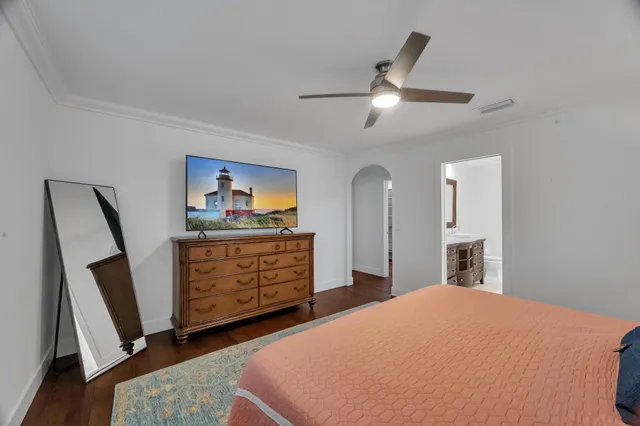 a bedroom with a bed and a dresser