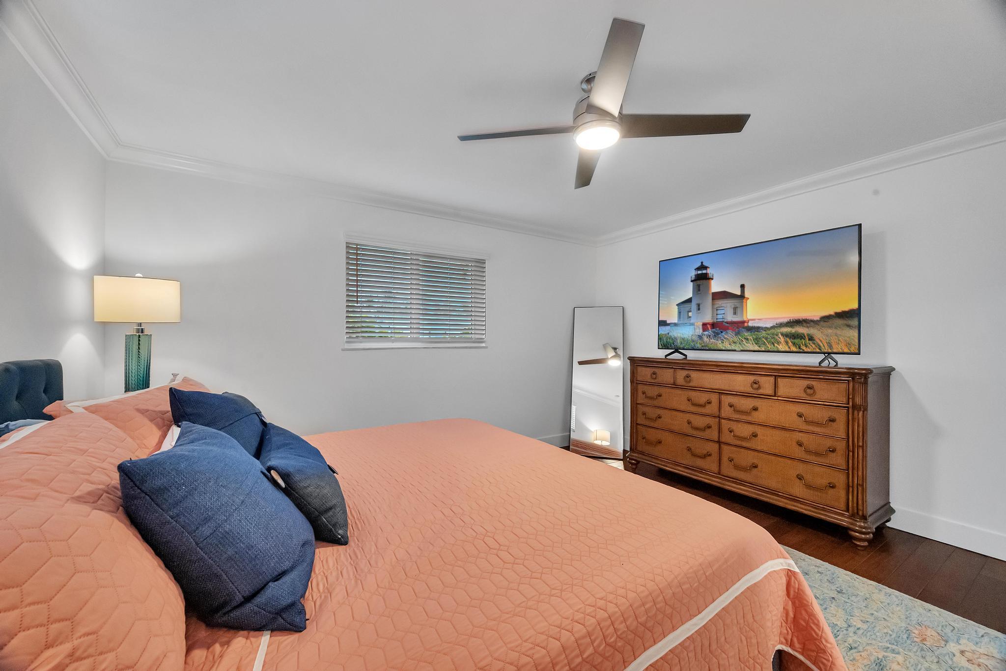 924 Pompano Drive Jupiter, FL 33458 - Photo 21 of 36 a bedroom with a bed and a dresser