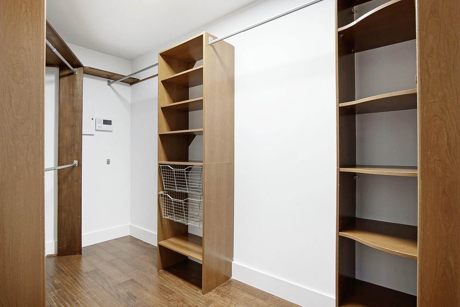 924 Pompano Drive Jupiter, FL 33458 - Photo 24 of 36 a view of an empty walk in closet and wooden floor
