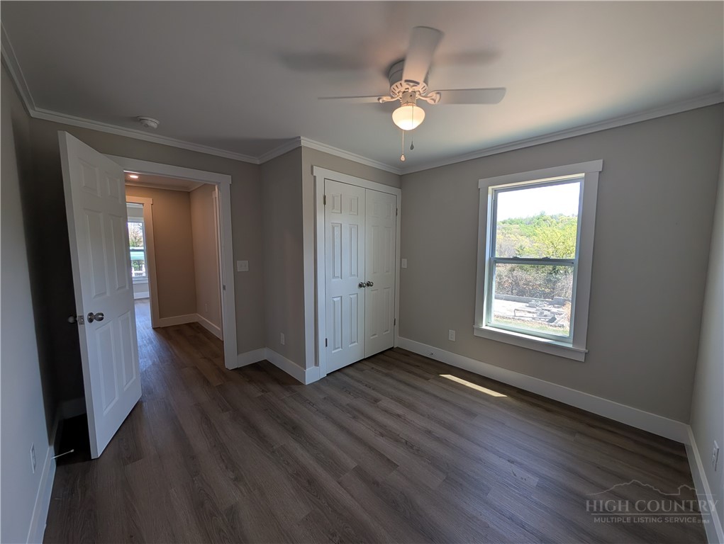 68 Estep Street Sparta, NC 28675 - Photo 13 of 21 an empty room with wooden floor and windows