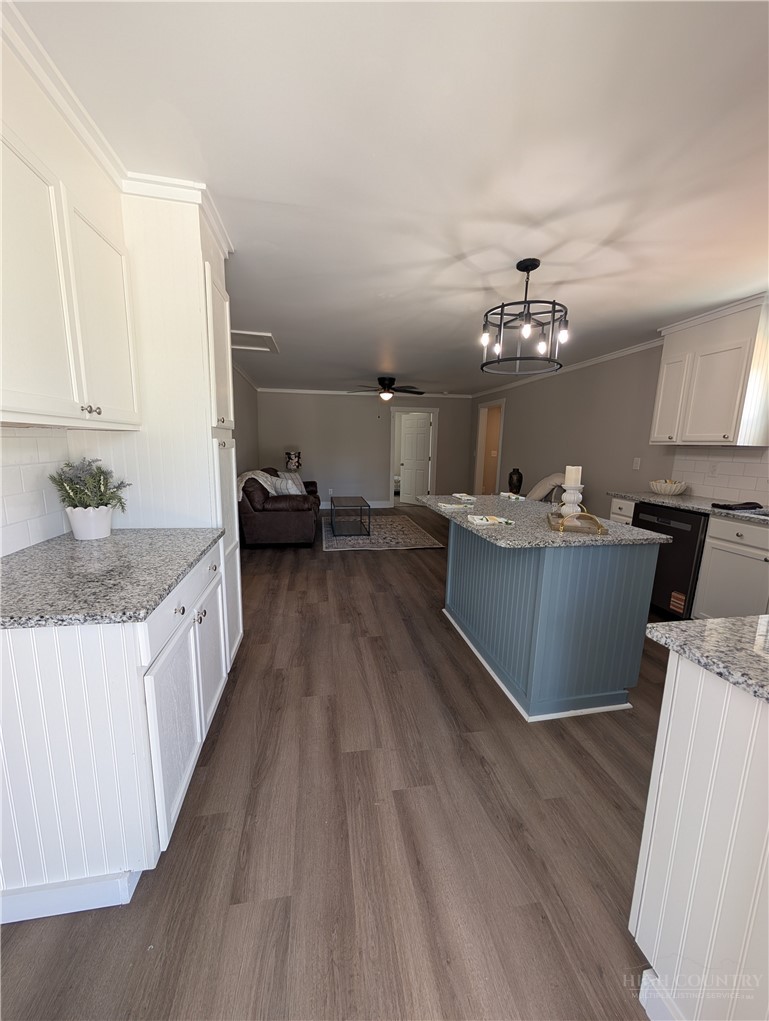 68 Estep Street Sparta, NC 28675 - Photo 2 of 21 a view of living room with kitchen island furniture and wooden floor