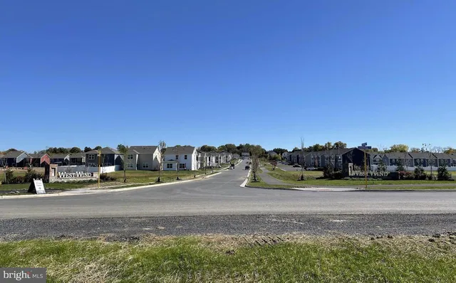 a swimming pool with outdoor seating and yard